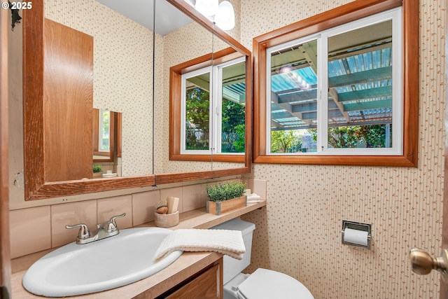 3116 Vista Dr, Forest Grove, OR 97116 - bathroom with wallpapered walls, vanity, and toilet