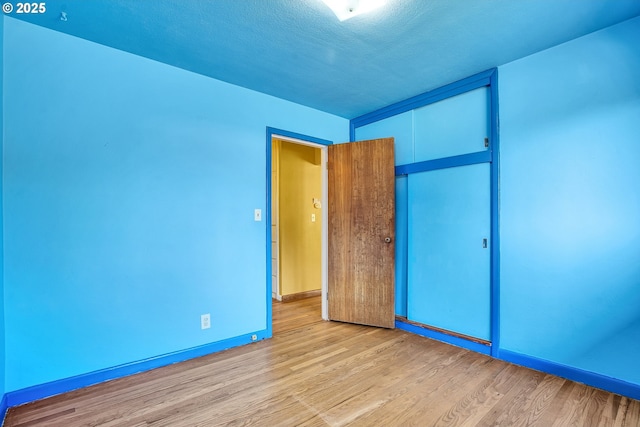 3116 Vista Dr, Forest Grove, OR 97116 - unfurnished bedroom featuring light wood-type flooring, a closet, and baseboards