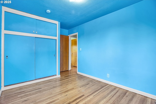 3116 Vista Dr, Forest Grove, OR 97116 - unfurnished bedroom featuring baseboards, light wood finished floors, and a closet