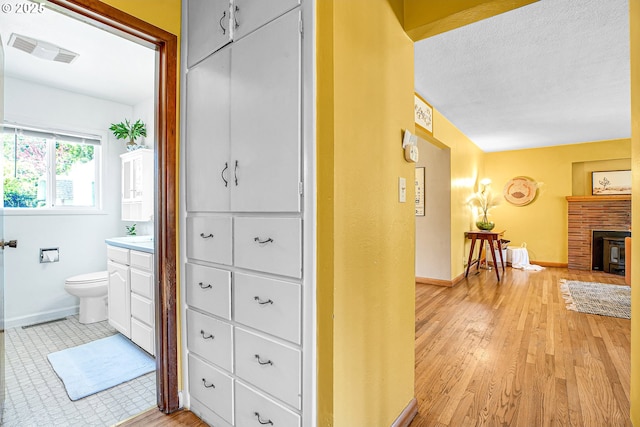 3116 Vista Dr, Forest Grove, OR 97116 - bathroom featuring toilet, baseboards, visible vents, wood finished floors, and vanity