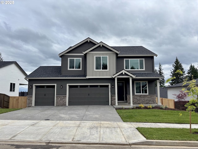 5568 N 93rd Ave Unit Lt203, Camas, WA 98607 - craftsman-style house featuring stone siding, concrete driveway, a garage, and roof with shingles