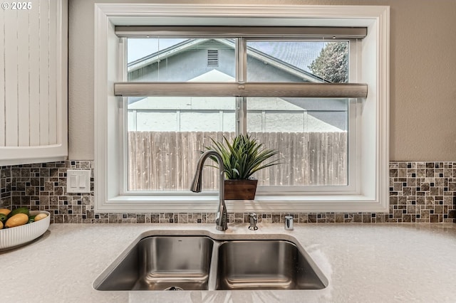 14905 SE Stevenson Dr, Vancouver, WA 98683 - kitchen view of a sink, backsplash, and light countertops
