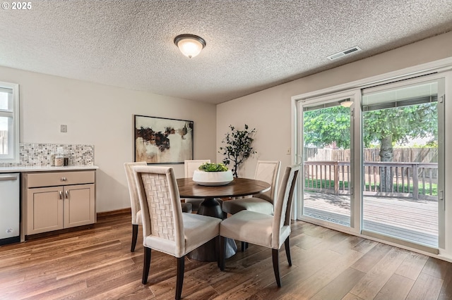 14905 SE Stevenson Dr, Vancouver, WA 98683 - dining room with light wood-type flooring and a textured ceiling