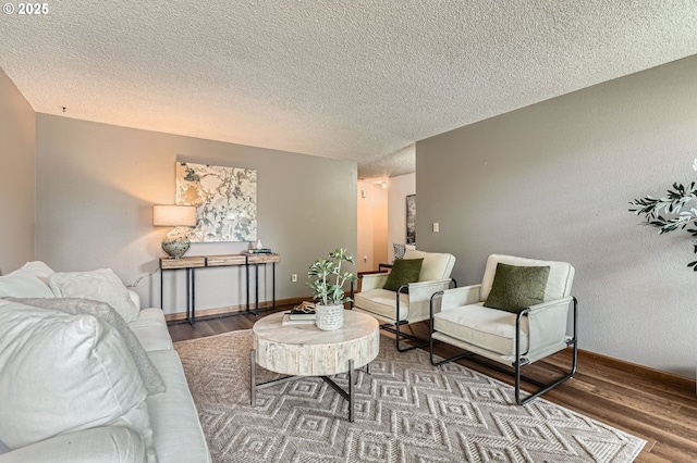 14905 SE Stevenson Dr, Vancouver, WA 98683 - living area featuring wood finished floors, a textured ceiling, and baseboards