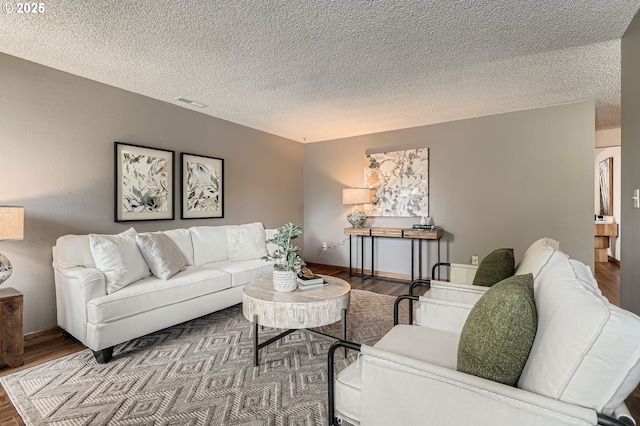 14905 SE Stevenson Dr, Vancouver, WA 98683 - living area featuring wood finished floors, a textured ceiling, and baseboards