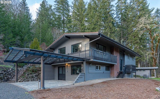 exterior space with stairs and a patio