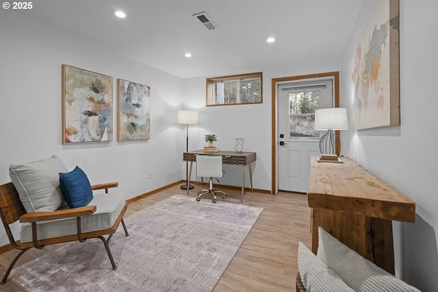 office with baseboards, light wood finished floors, visible vents, and recessed lighting