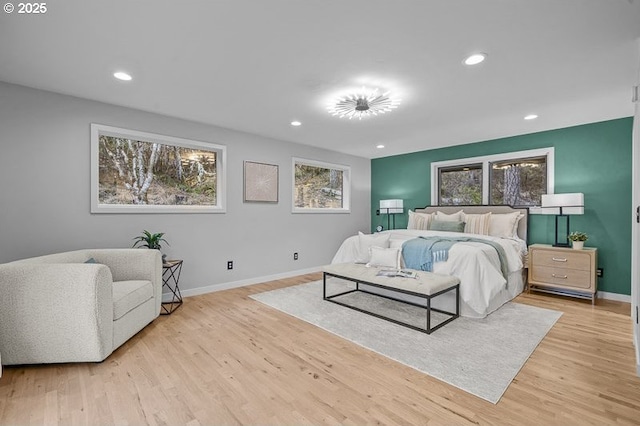 bedroom with recessed lighting, baseboards, and light wood finished floors