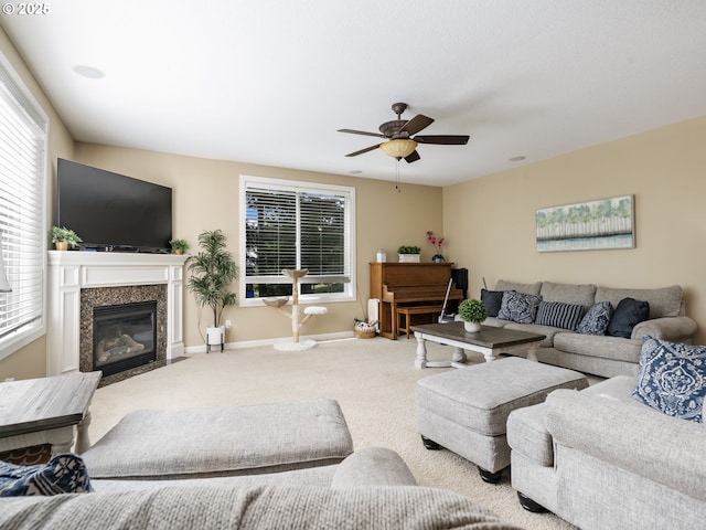 22824 NE 254th Ct, Battle Ground, WA 98604 - living area featuring carpet floors, ceiling fan, baseboards, and a high end fireplace