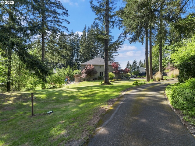 22824 NE 254th Ct, Battle Ground, WA 98604 - view of front facade with a front yard and asphalt driveway