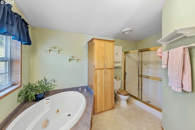 bathroom with toilet, a whirlpool tub, and a stall shower