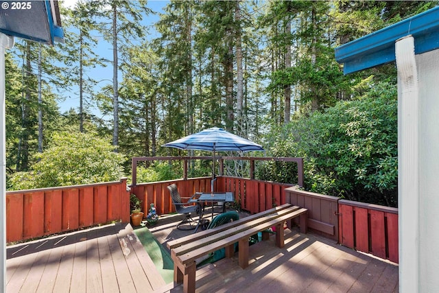 wooden deck featuring outdoor dining space