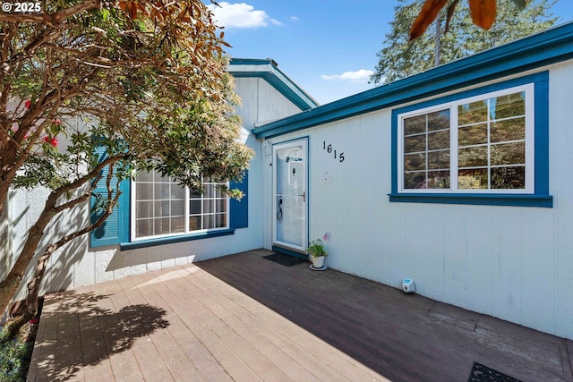 property entrance with a wooden deck