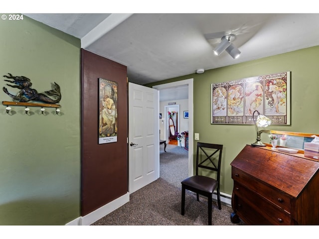 corridor with baseboards and carpet