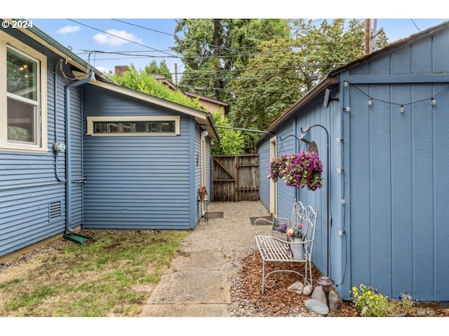 exterior space featuring an outdoor structure and fence