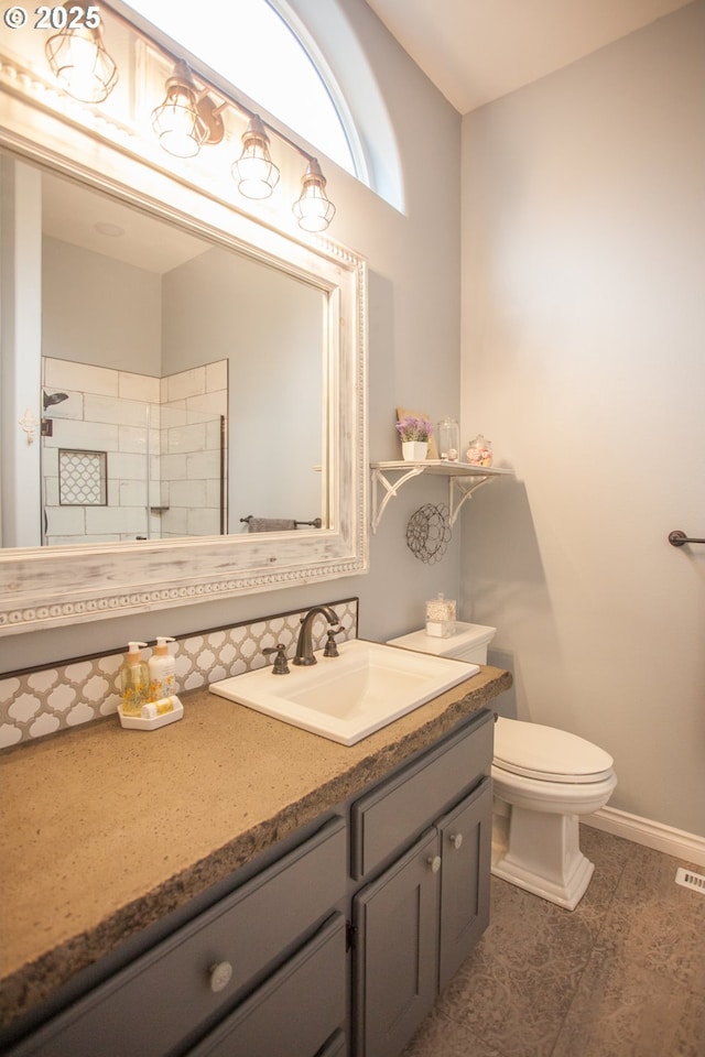 bathroom featuring toilet and vanity