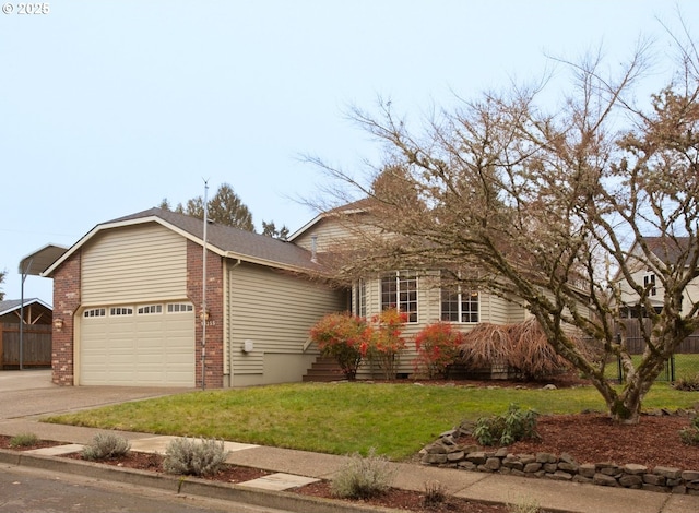 view of front of home with a front lawn and a garage