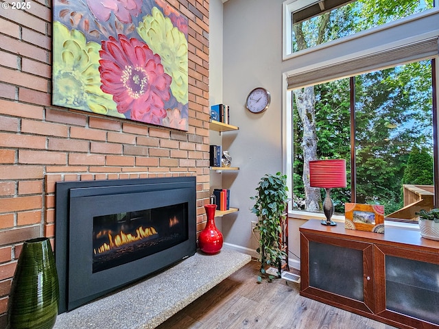 12066 SE 104th Ct Unit 20, Happy Valley, OR 97086 - detailed view of wood finished floors and a brick fireplace