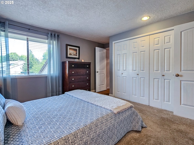 12066 SE 104th Ct Unit 20, Happy Valley, OR 97086 - carpeted bedroom with a textured ceiling and a closet