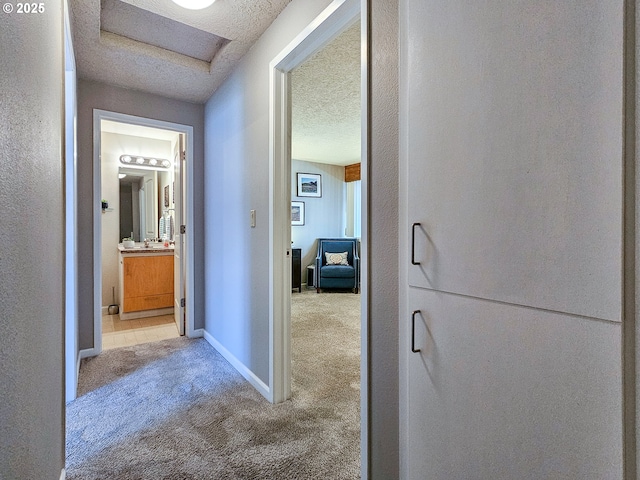 12066 SE 104th Ct Unit 20, Happy Valley, OR 97086 - corridor featuring carpet floors and a textured ceiling