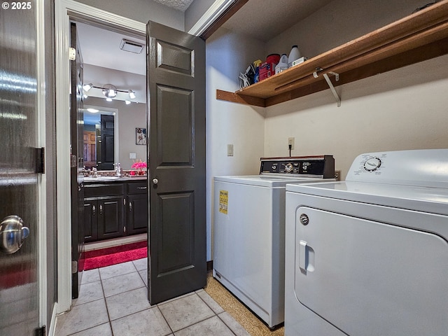 12066 SE 104th Ct Unit 20, Happy Valley, OR 97086 - laundry area featuring separate washer and dryer and light tile patterned floors
