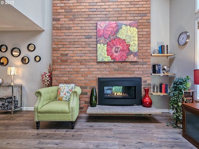 12066 SE 104th Ct Unit 20, Happy Valley, OR 97086 - living room featuring wood finished floors and a brick fireplace