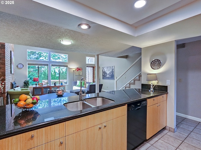 12066 SE 104th Ct Unit 20, Happy Valley, OR 97086 - kitchen with black dishwasher, light tile patterned floors, dark stone countertops, open floor plan, and light brown cabinetry