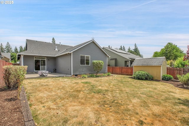 20021 Tharp Ct, Oregon City, OR 97045 - rear view of property with a patio, a fenced backyard, a shingled roof, and a storage unit