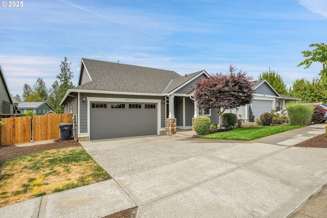 20021 Tharp Ct, Oregon City, OR 97045 - view of front facade with concrete driveway, a garage, and a shingled roof