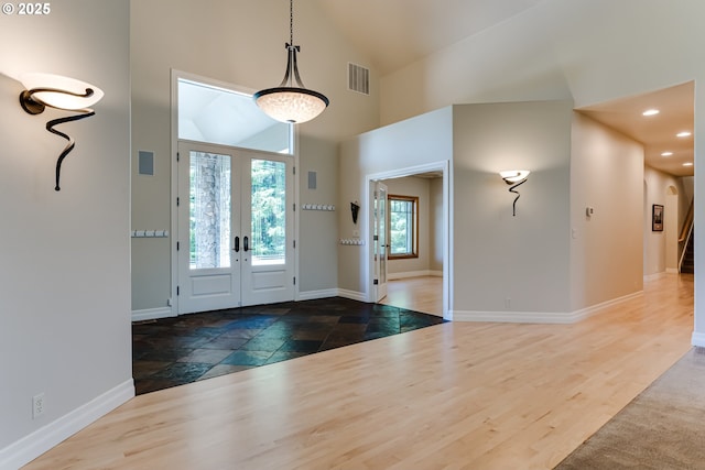 85339 Svarverud Rd, Eugene, OR 97405 - entryway with french doors, high vaulted ceiling, baseboards, recessed lighting, and stone tile floors