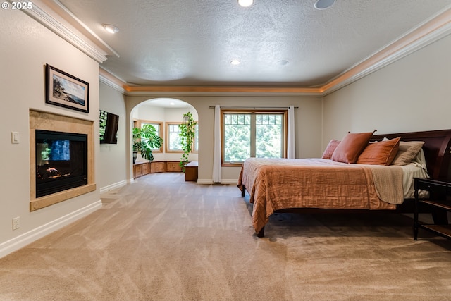 85339 Svarverud Rd, Eugene, OR 97405 - bedroom with light carpet, ornamental molding, a textured ceiling, baseboards, and a tiled fireplace