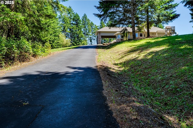 85339 Svarverud Rd, Eugene, OR 97405 - view of front of home featuring asphalt driveway and a front lawn