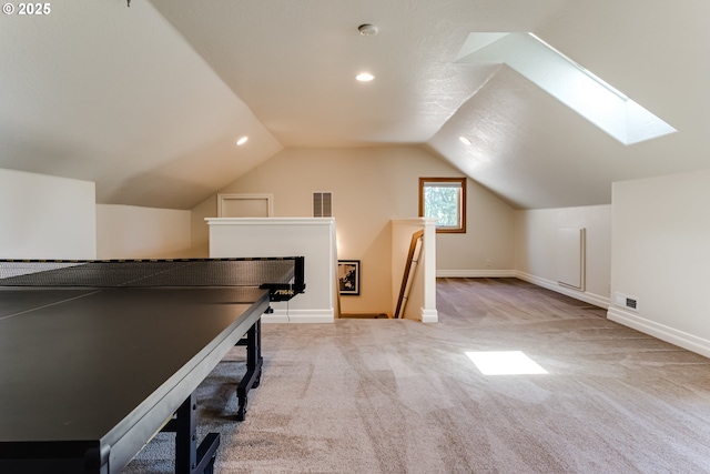 85339 Svarverud Rd, Eugene, OR 97405 - recreation room with carpet flooring, vaulted ceiling, baseboards, recessed lighting, and a skylight
