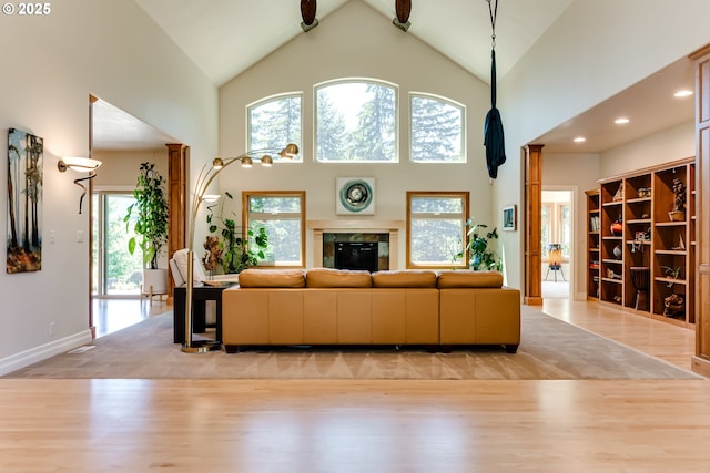 85339 Svarverud Rd, Eugene, OR 97405 - living area featuring wood finished floors, baseboards, high vaulted ceiling, and recessed lighting