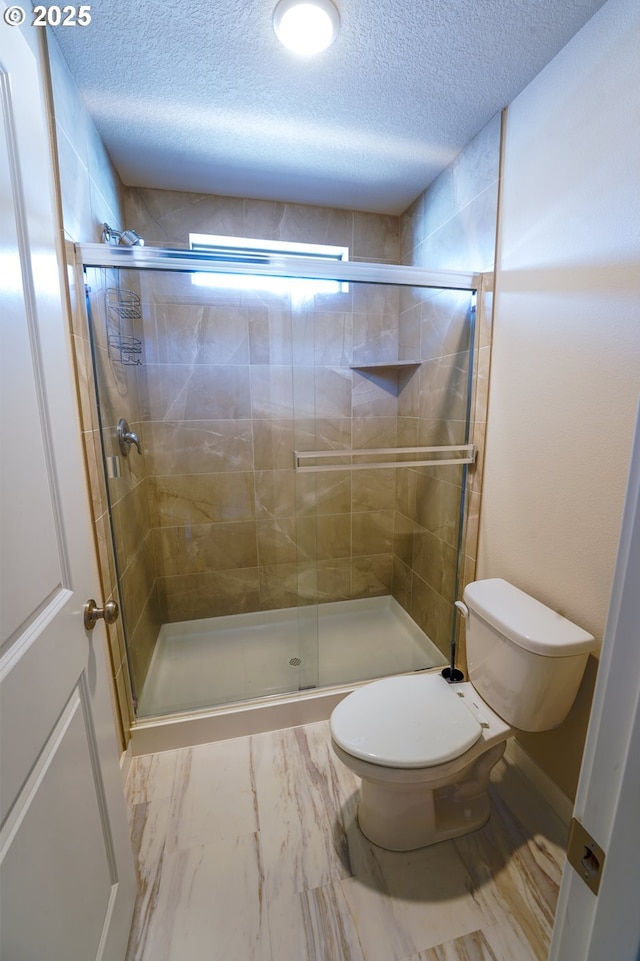 11473 SE Pleasant Valley Pkwy, Happy Valley, OR 97086 - full bathroom featuring toilet, a textured ceiling, and a stall shower
