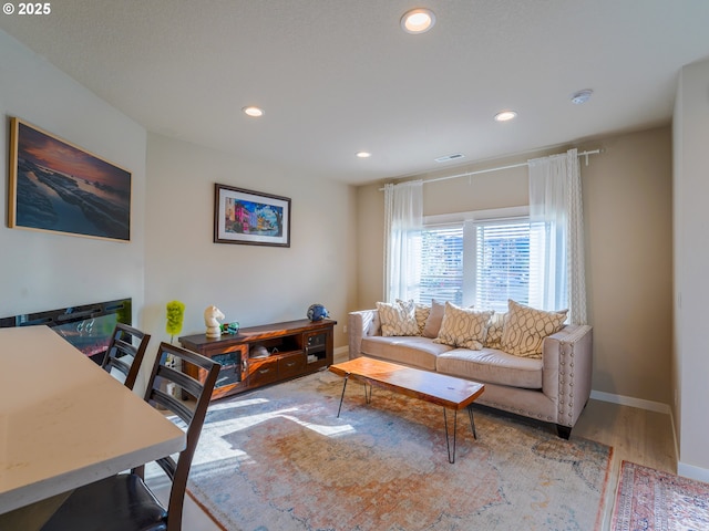 11473 SE Pleasant Valley Pkwy, Happy Valley, OR 97086 - living room featuring recessed lighting, wood finished floors, and baseboards