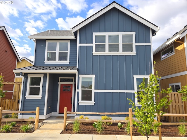 7265 SE Duke St Unit 2, Portland, OR 97206 - view of front facade with board and batten siding, fence, a standing seam roof, and metal roof