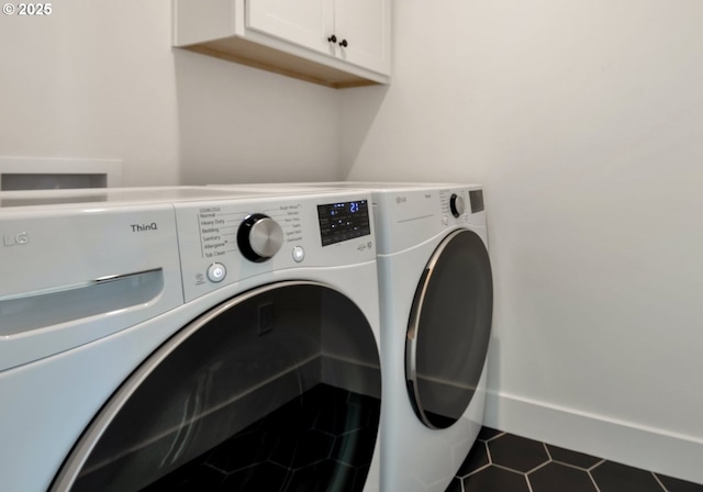 7265 SE Duke St Unit 2, Portland, OR 97206 - laundry area with washing machine and clothes dryer, cabinet space, and tile patterned flooring