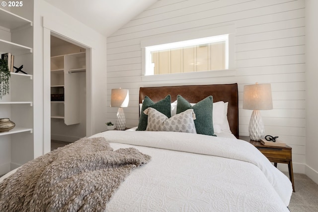 7265 SE Duke St Unit 2, Portland, OR 97206 - carpeted bedroom featuring lofted ceiling, wooden walls, and a closet