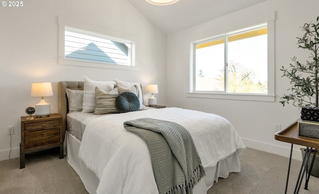 7265 SE Duke St Unit 2, Portland, OR 97206 - bedroom with light colored carpet, multiple windows, vaulted ceiling, and baseboards