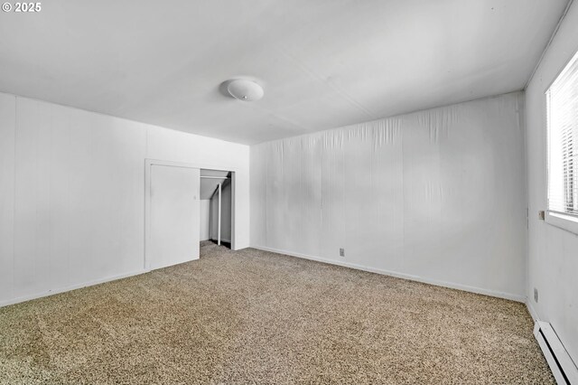 2134 Minnesota St, Eugene, OR 97402 - unfurnished bedroom featuring a baseboard heating unit, carpet floors, and a closet