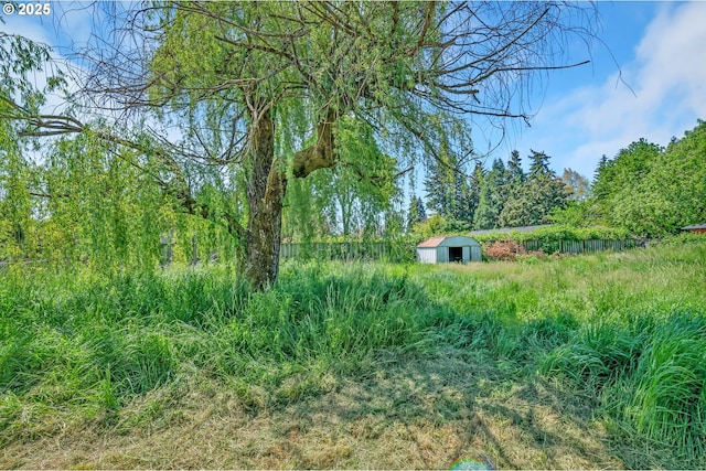 2134 Minnesota St, Eugene, OR 97402 - view of yard with an outdoor structure and a storage unit