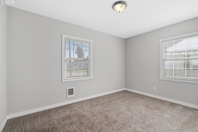 empty room with carpet flooring