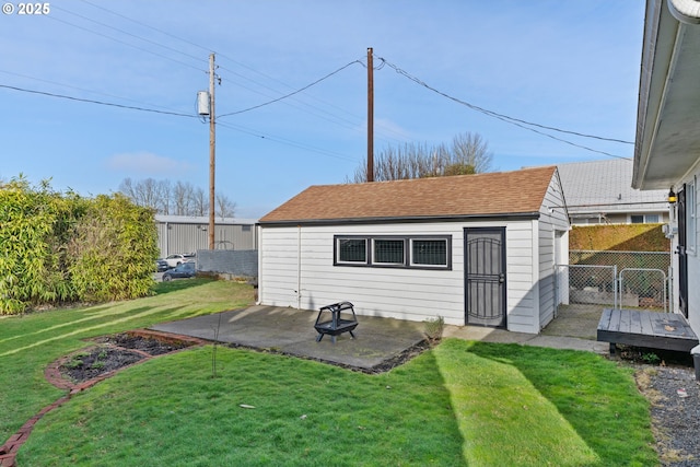 view of outbuilding featuring a lawn