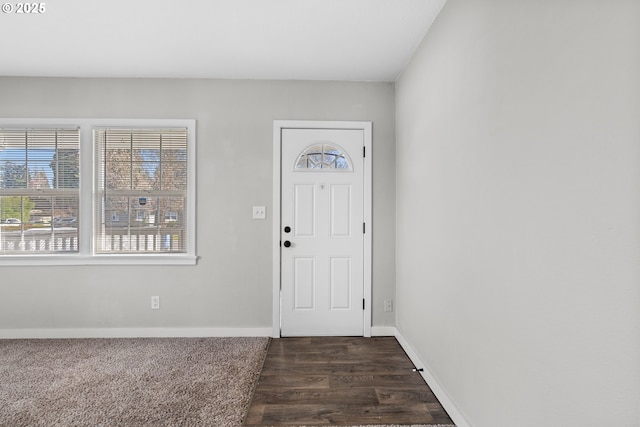 entrance foyer with dark hardwood / wood-style floors