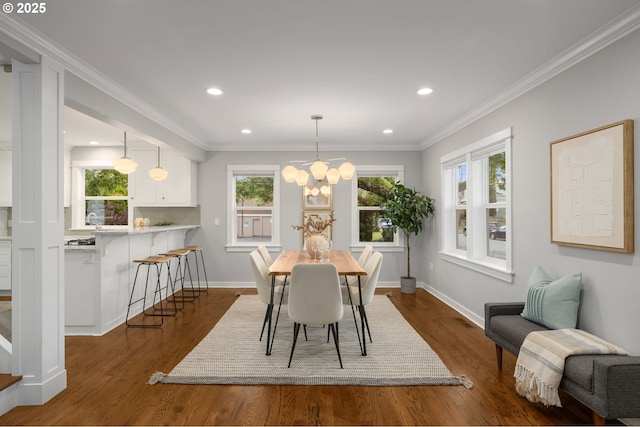 7928 SE 21st Ave, Portland, OR 97202 - dining space featuring dark wood-style floors, recessed lighting, a chandelier, and crown molding