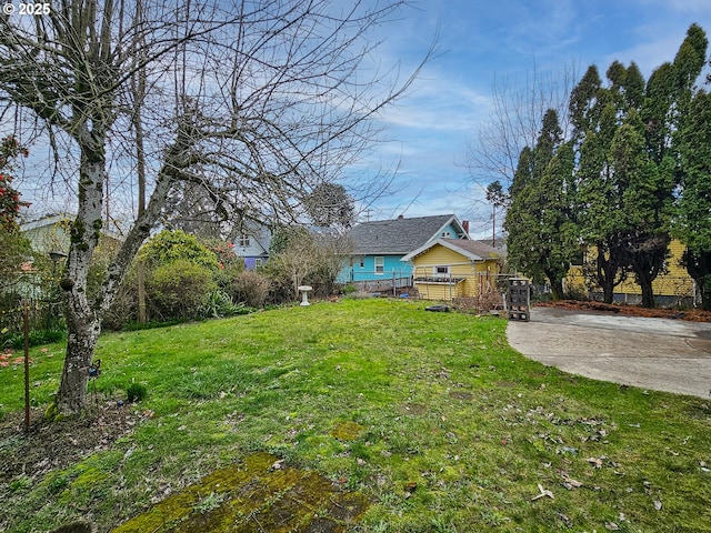 view of yard with a wooden deck