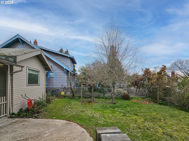 view of yard with a fenced backyard and a patio area
