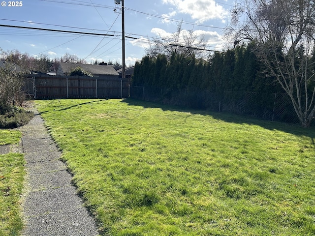 view of yard with fence