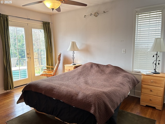 bedroom with ceiling fan, french doors, wood finished floors, and access to outside